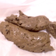 A masked brunette girl in a red top and denim skirt can't hold it. She bends over and spreads her ass, then squats and drops a big pile of soft turds onto paper and shows off her mess. Two scenes. 40MB, MP4 file. About 5 minutes.
